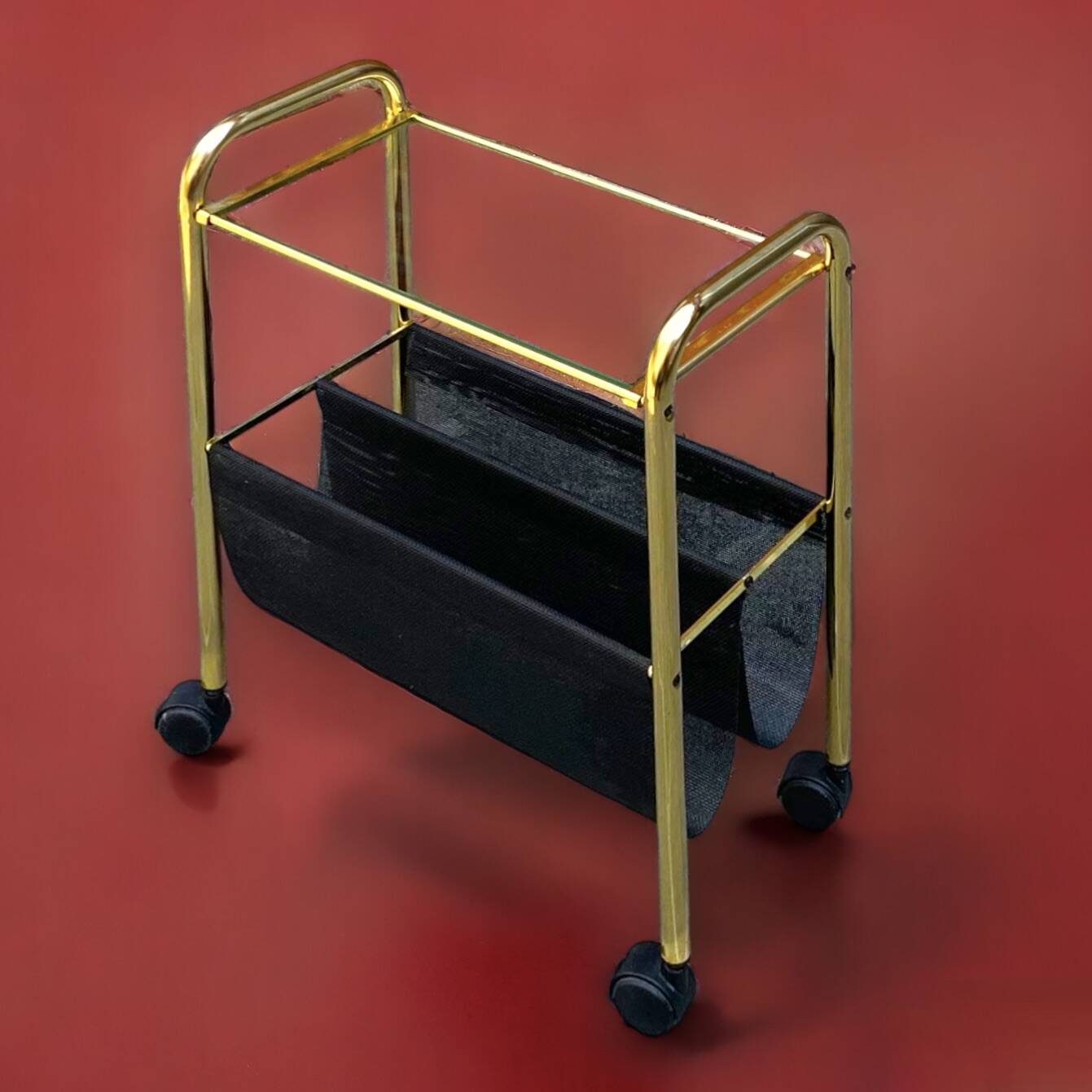 Magazine rack, saddle on vintage wheels