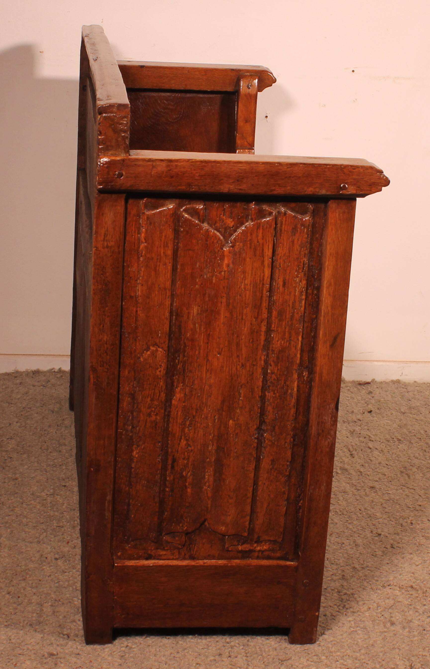 Oak bench chest with incorporated panels and gothic elements