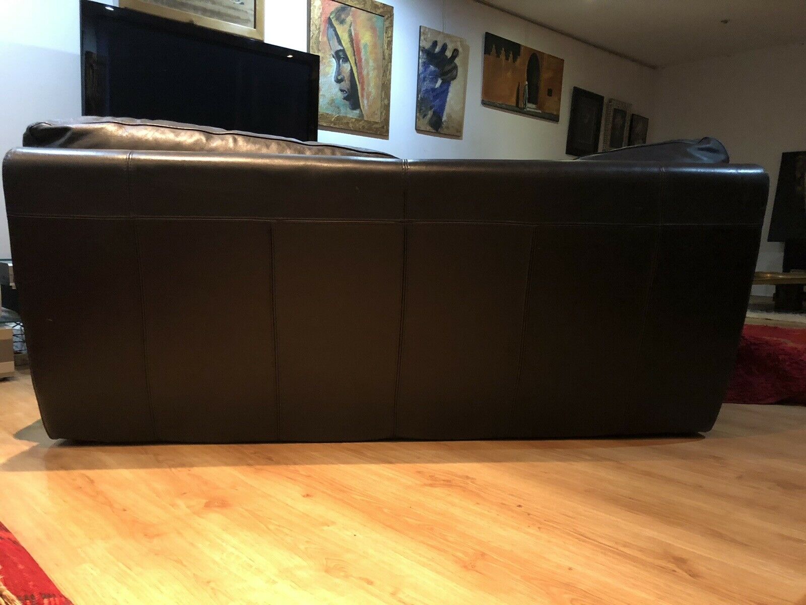 Pair of 2-seater sofas in black leather Roche & Bobois