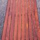 1970s design coffee table with ceramic and wood top, metal legs.