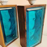 Two Swedish table lamps in solid pressed blue glass and teak wood "frame".
