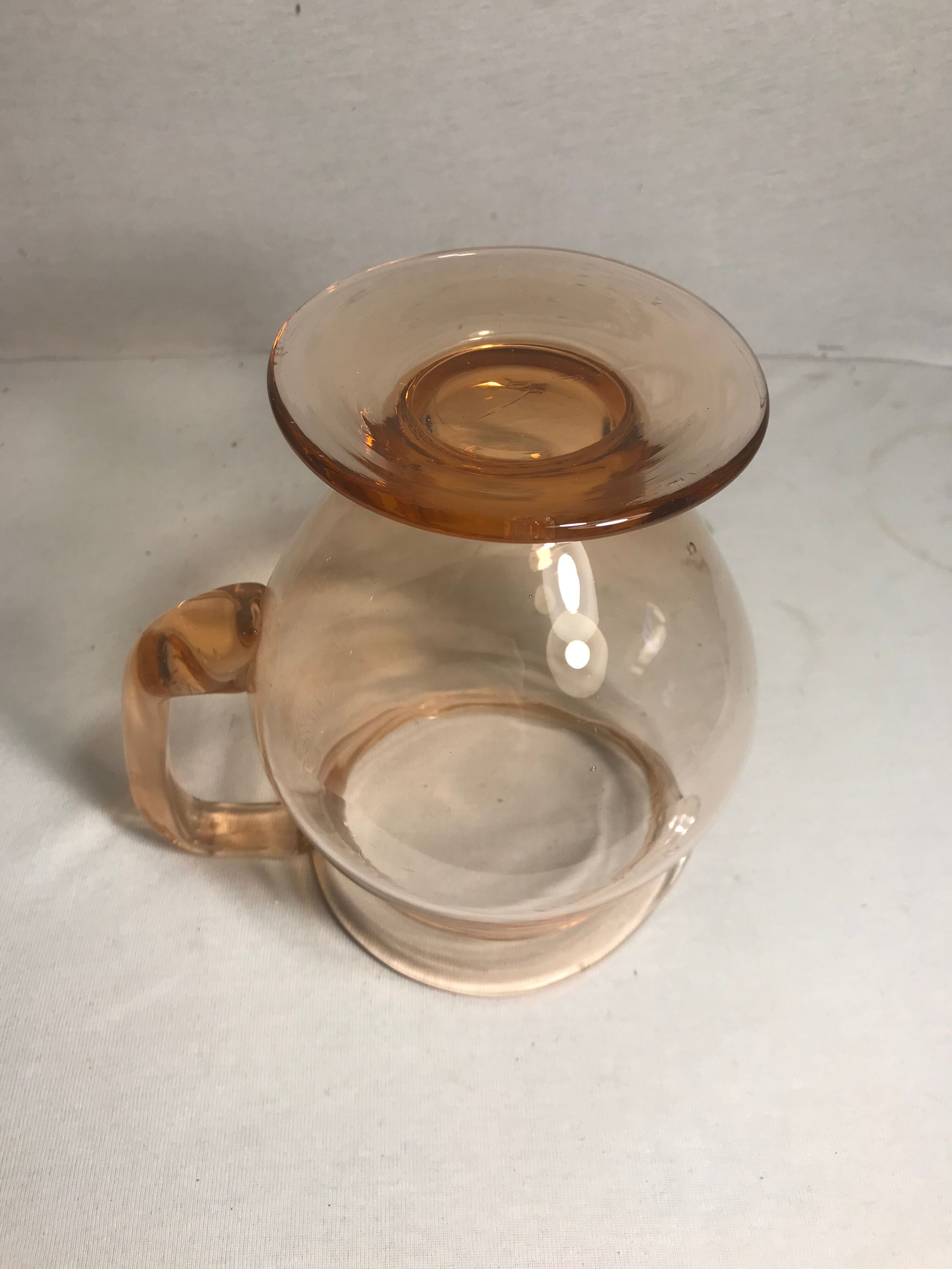 Pink pitcher in bubble glass