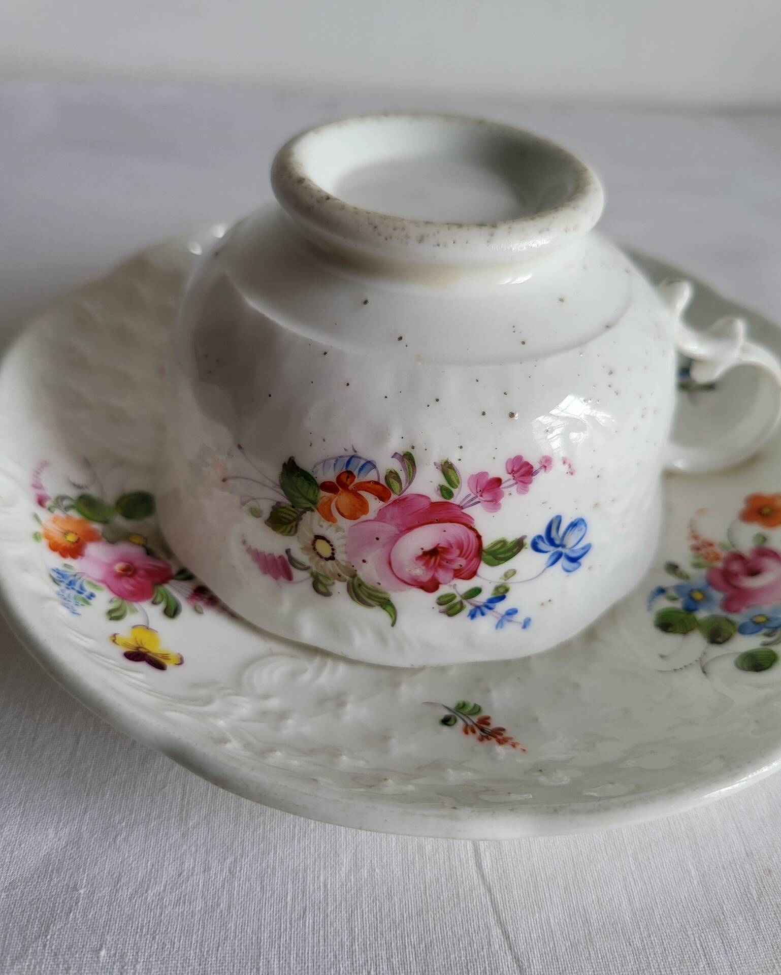 Antique Cup and Saucer in Porcelain with Hand-Painted Floral Decoration