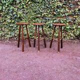 Set of three brutalist tripod stools