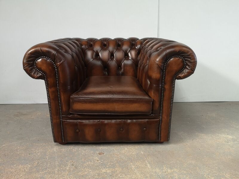 Brown leather chesterfield armchair