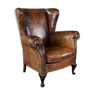 Fauteuil à oreilles en cuir de mouton