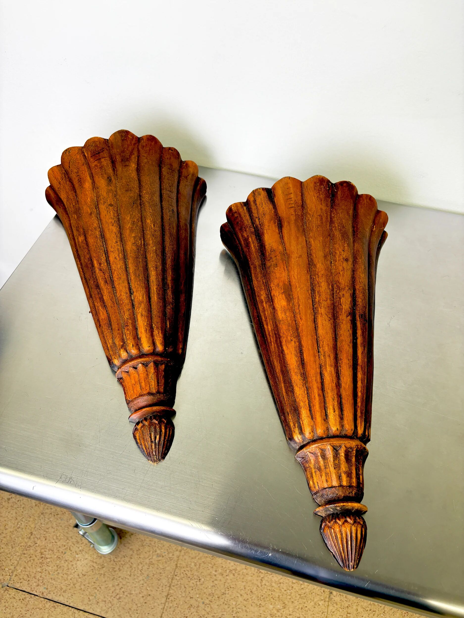 Pair of Art Deco carved wood wall sconces, France, 1930s