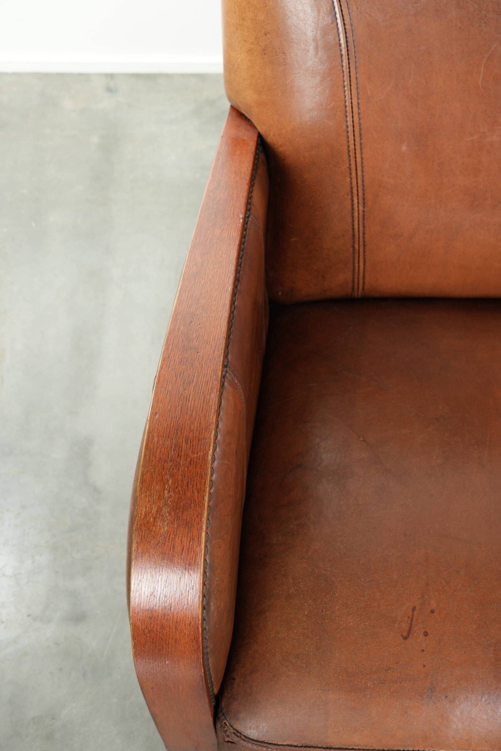 Sheepskin armchair in Art Deco style with wooden armrests