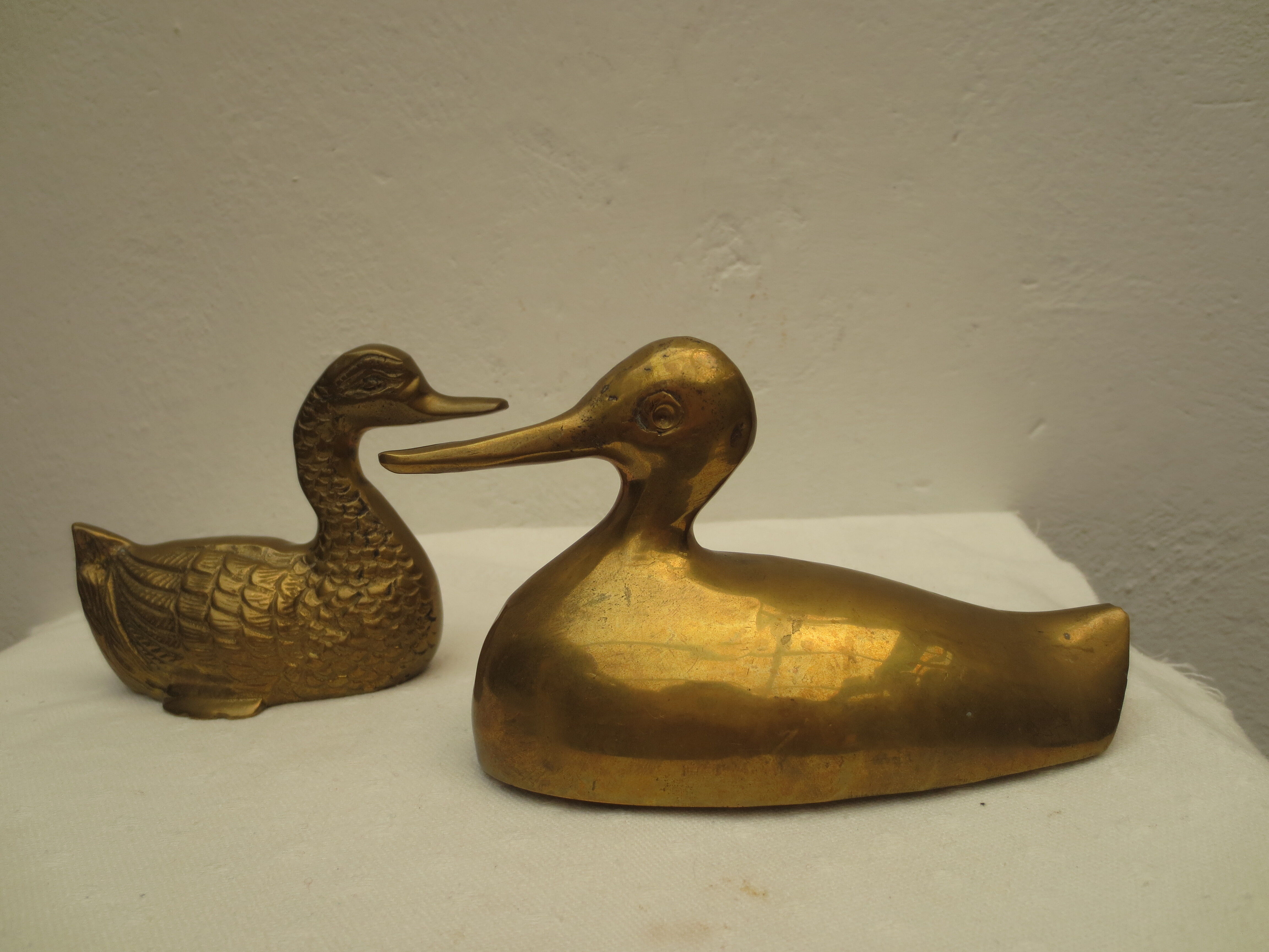 Vintage brass duck duo