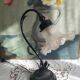 Tulip lamp in patinated black metal with an opaque glass shade.