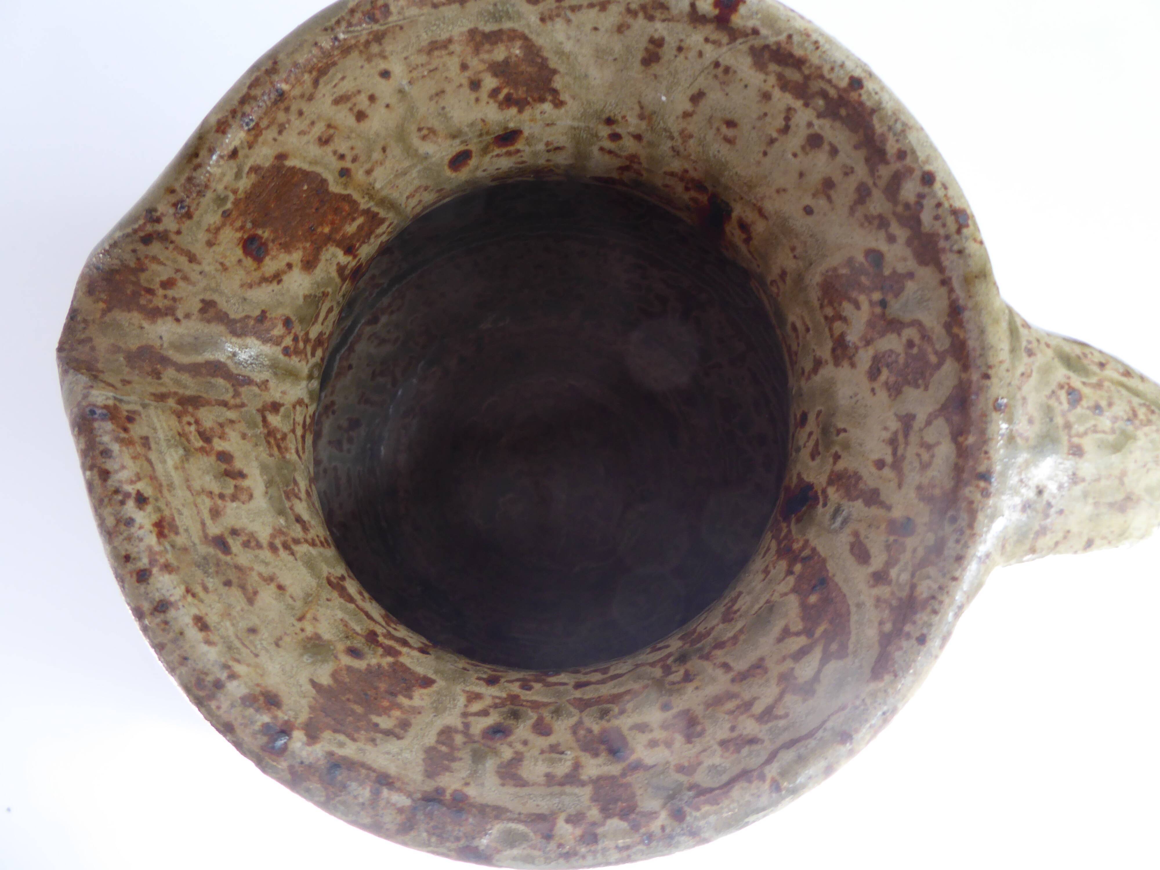 Signed vernissé sandstone pitcher