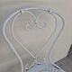 Pair of wrought iron garden chairs, antique manufacture