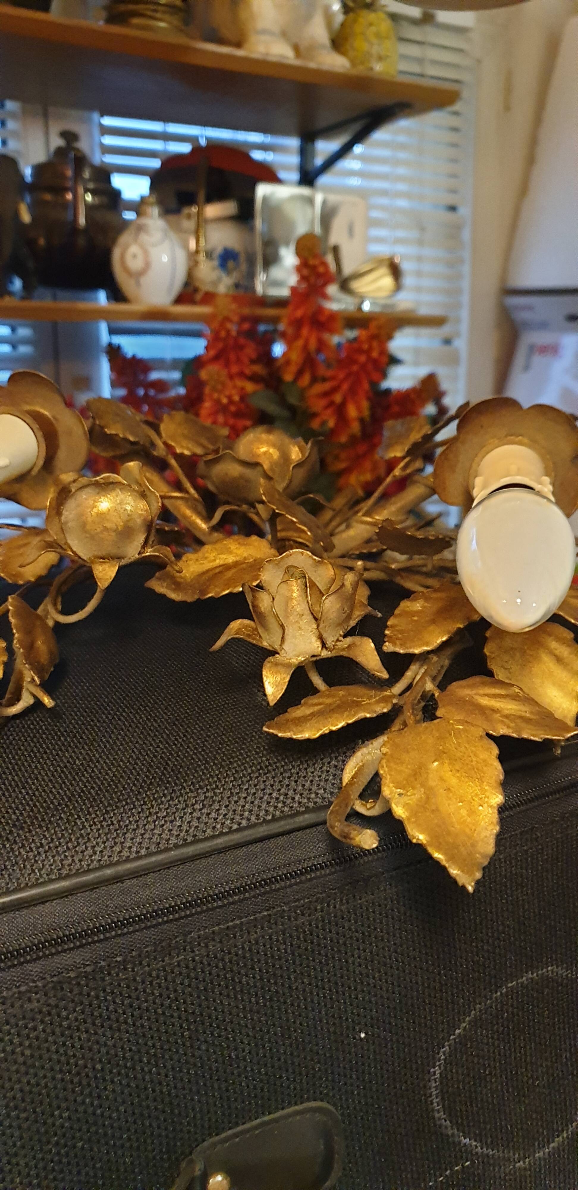 Pair of gold metal wall lights