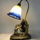 Vintage bronze table lamp featuring a painter on a mirror from the 1960s.