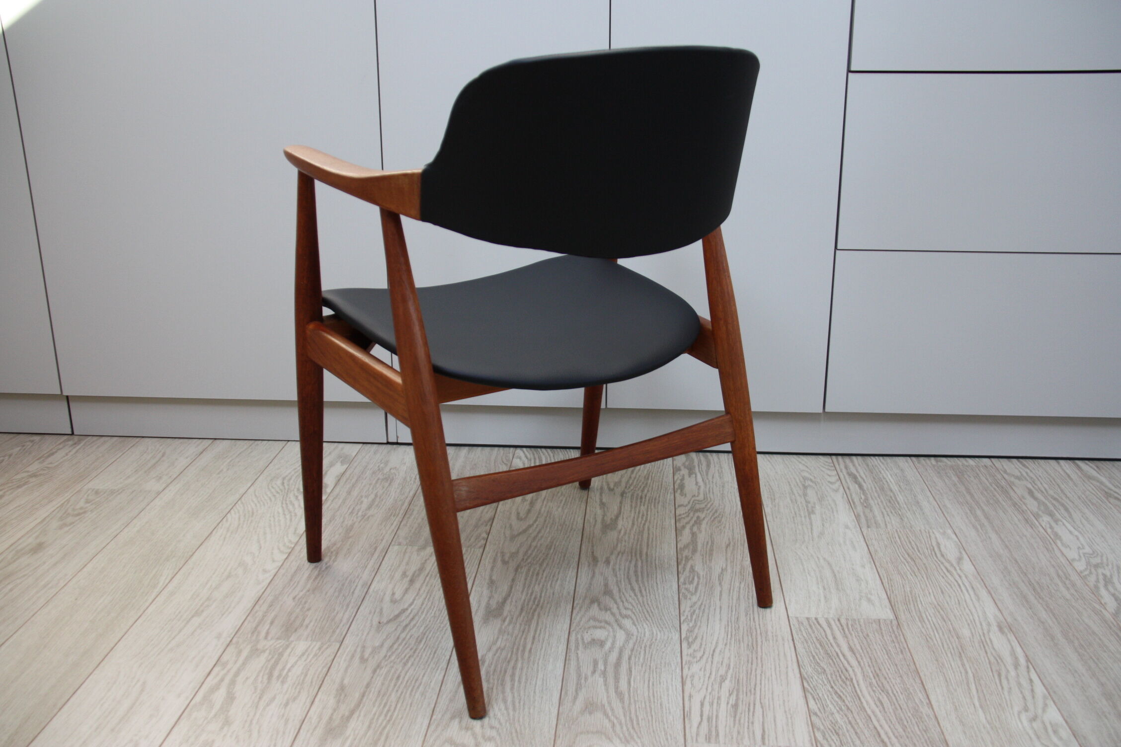 Vintage armchair in teak and black leather model Casina 60s