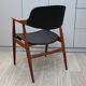 Vintage armchair in teak and black leather model Casina 60s
