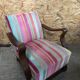 Old wooden armchair with curved armrests