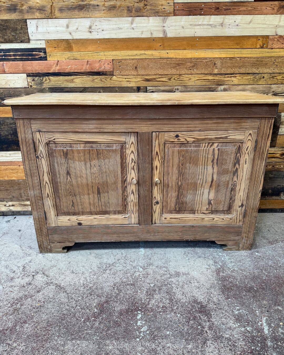 Old low sideboard in solid pitch pine