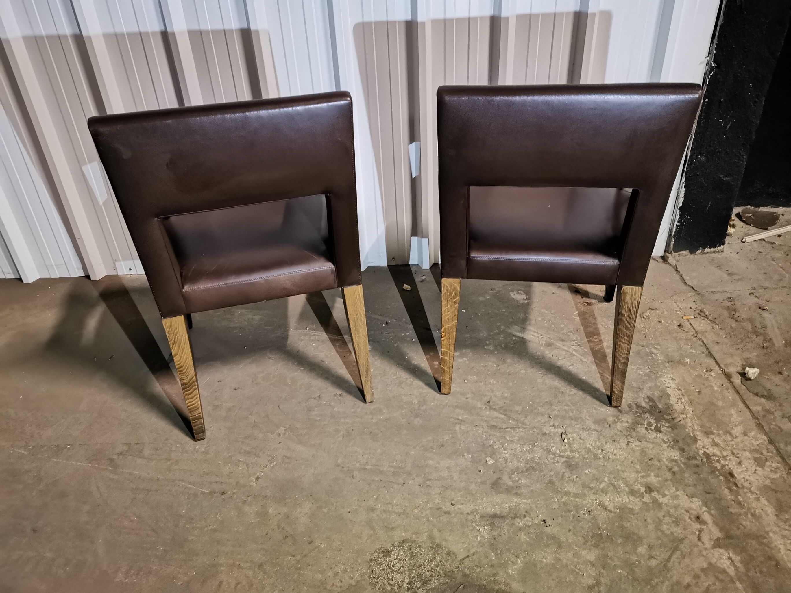 pair of leather armchairs (French cow) by Michel Hurel