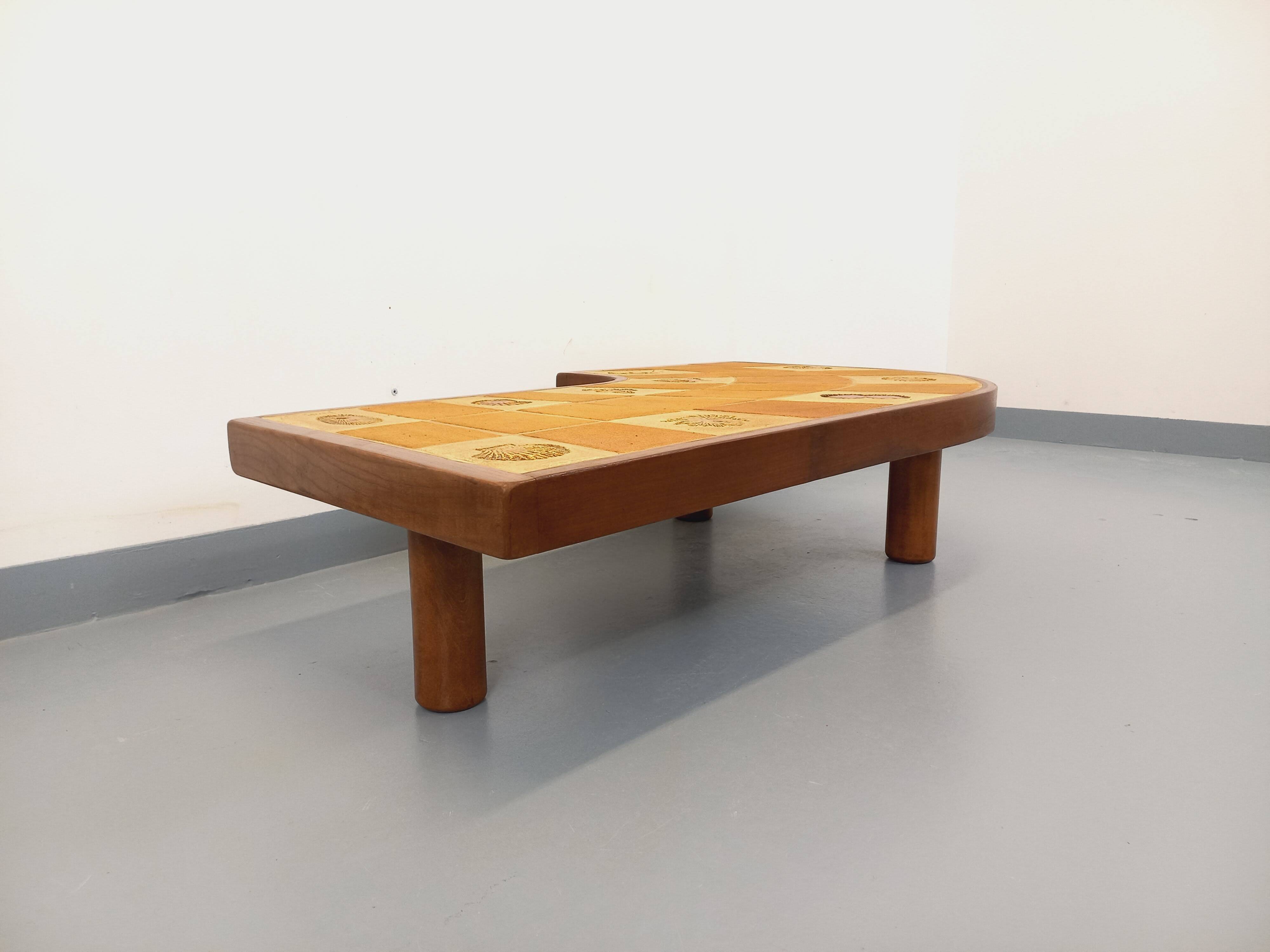 Barrois vintage shell-patterned comma coffee table in wood and ceramic.