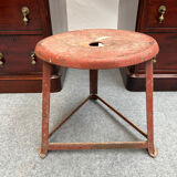 Red tripod industrial metal stool