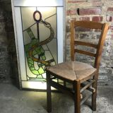 Old stained glass sign with deciduous decoration and microscope