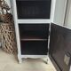 Two solid wood bedside tables with calfskin decoration.
