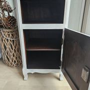 Two solid wood bedside tables with calfskin decoration.
