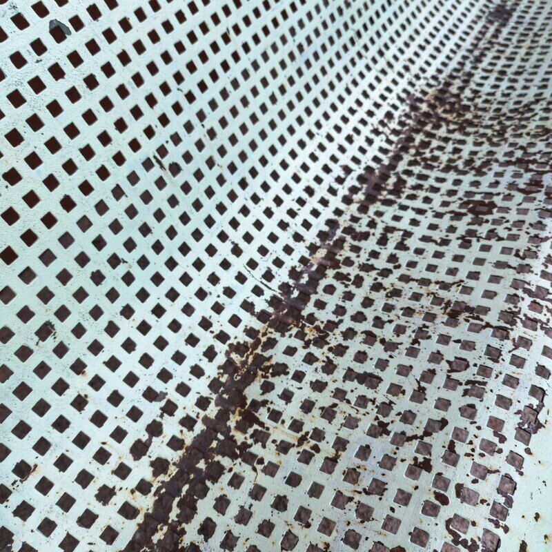 Public bench made of perforated iron