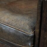 Beautiful vintage sheep leather armchair with a characterful appearance