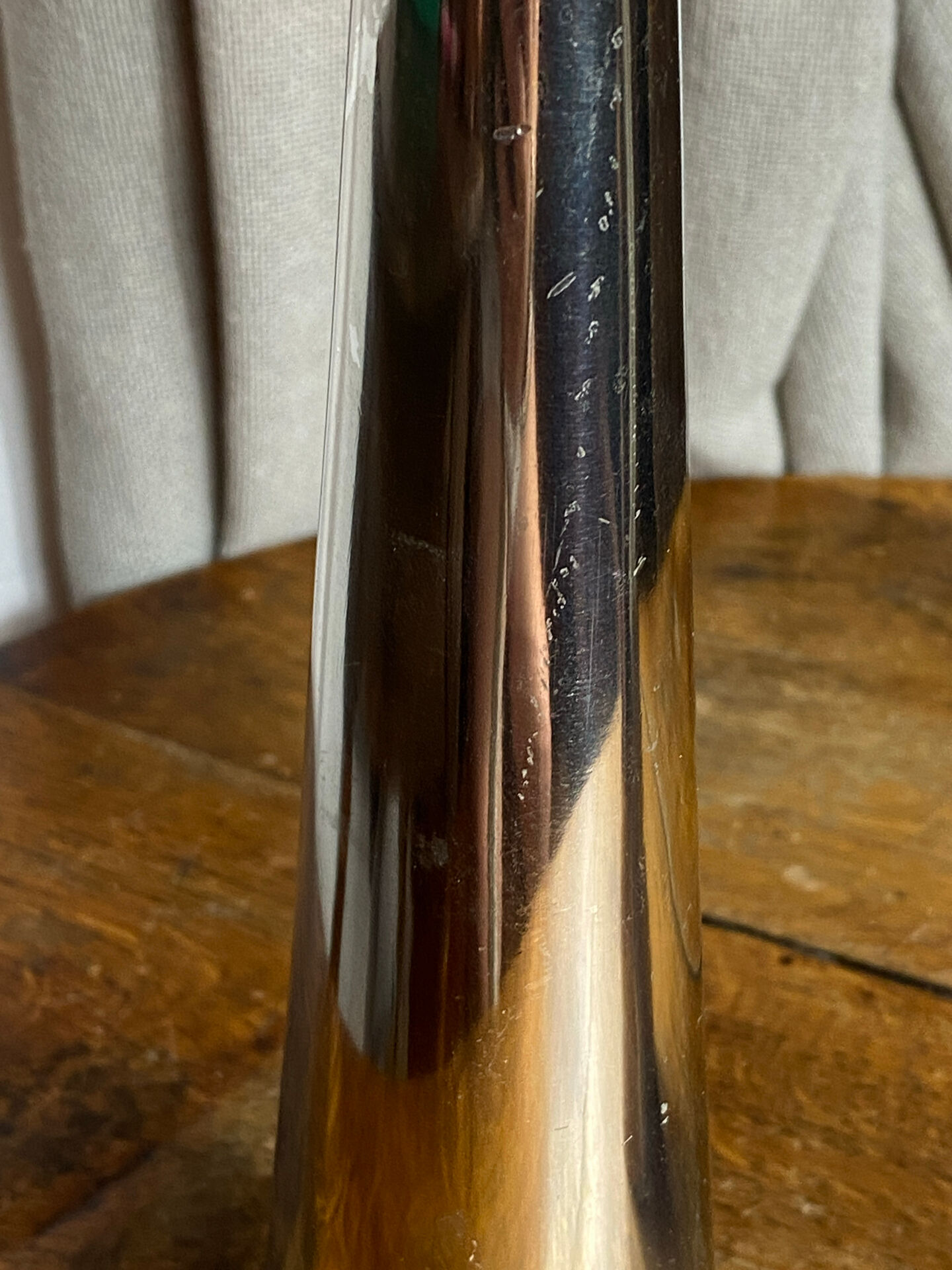 Pair of polished aluminium candlesticks