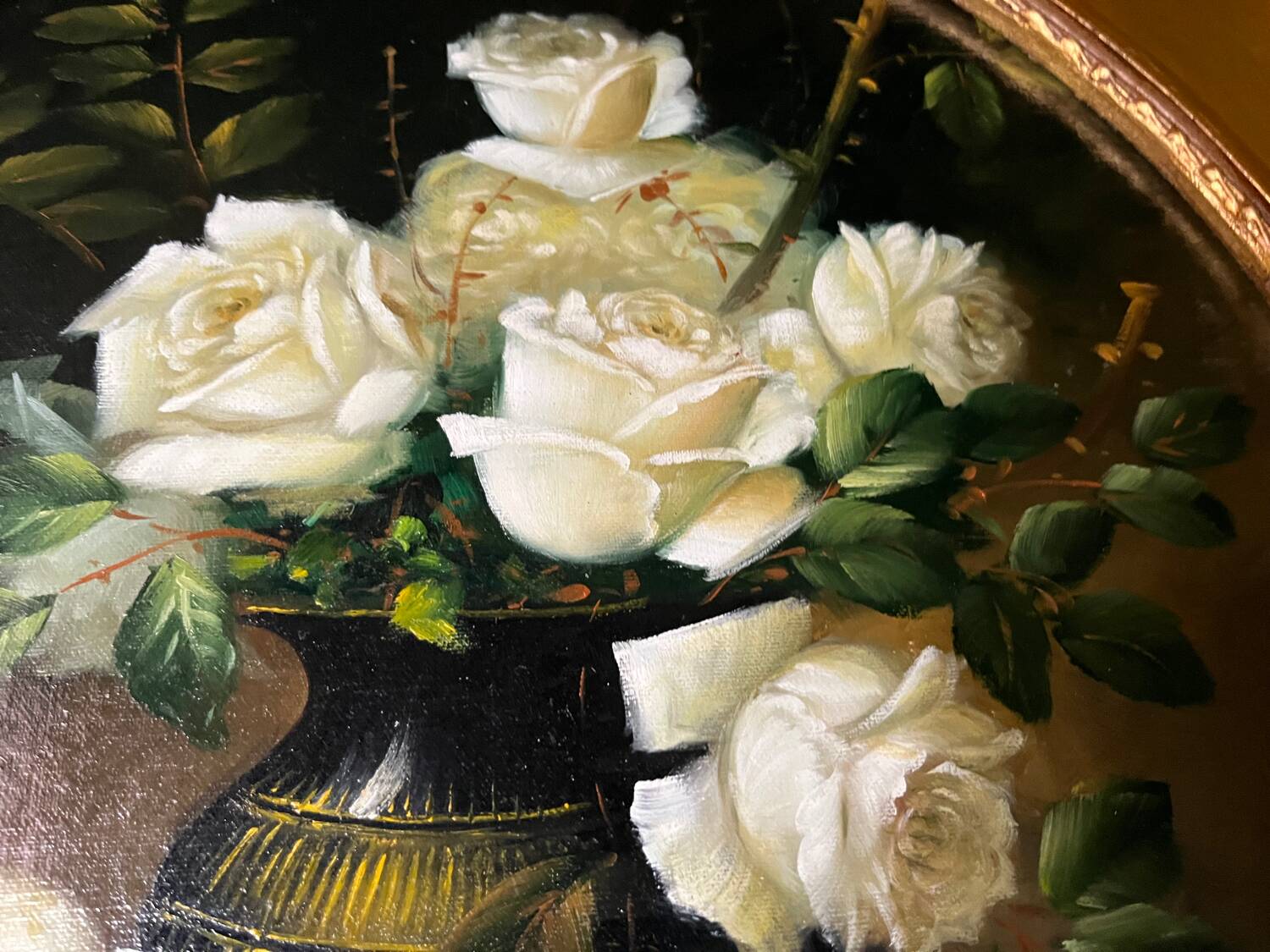 Large still life with white roses in an old gilded oval frame.