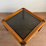 Square wooden coffee table with glass.