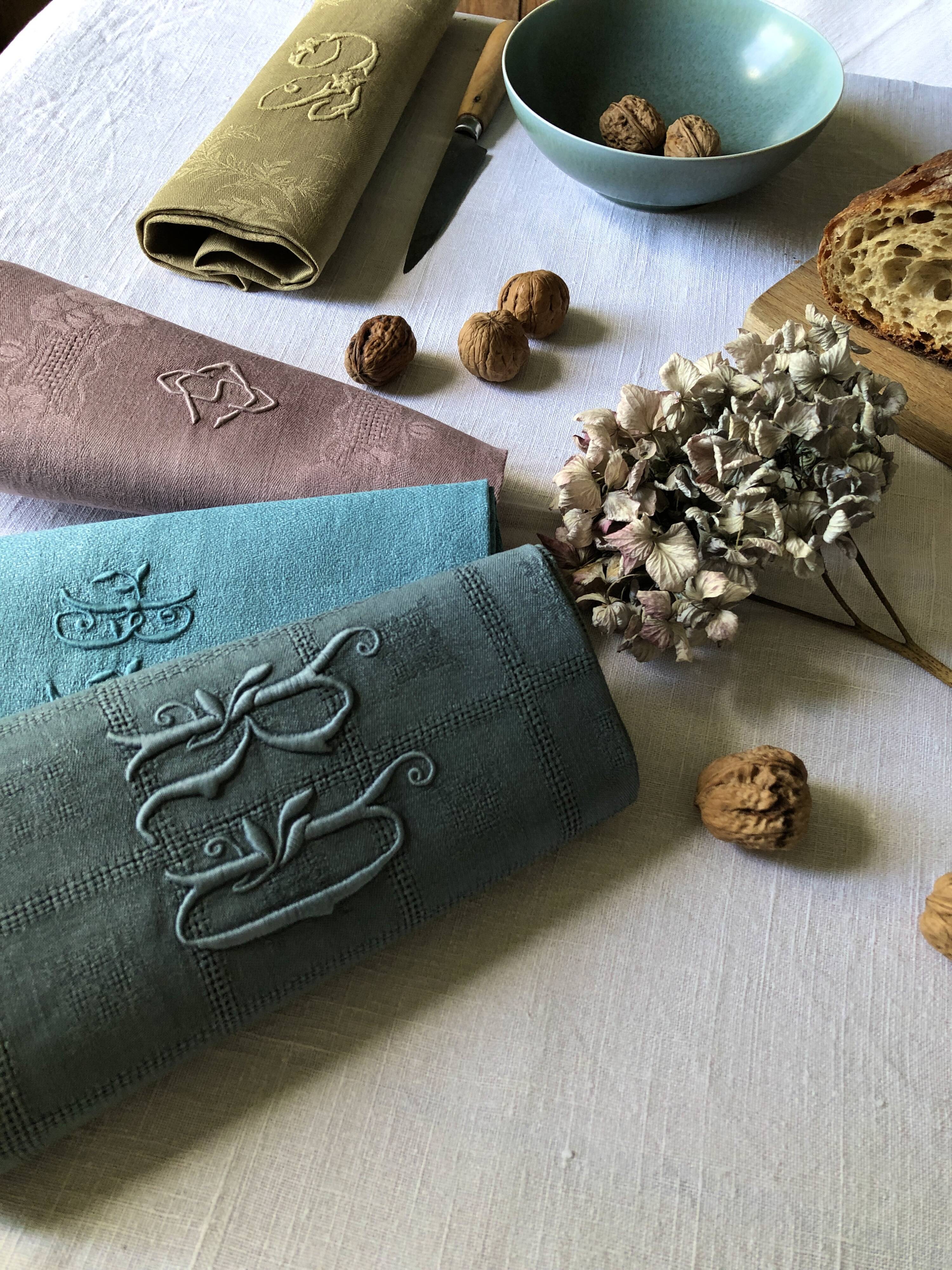 Suite of four tinted antique napkins