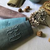 Suite of four tinted antique napkins