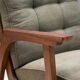 Pair of vintage mid-century lounge armchairs with wooden frames and green upholstery, 68 × 78 × 84 cm