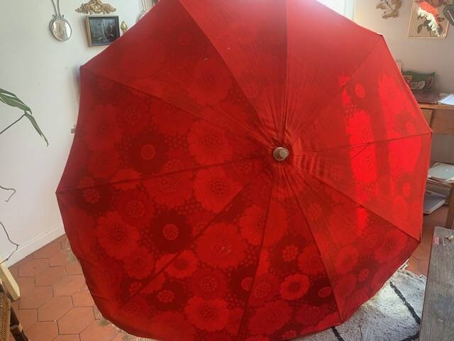 Large floral tilting beach umbrella with cotton fringes, 1960