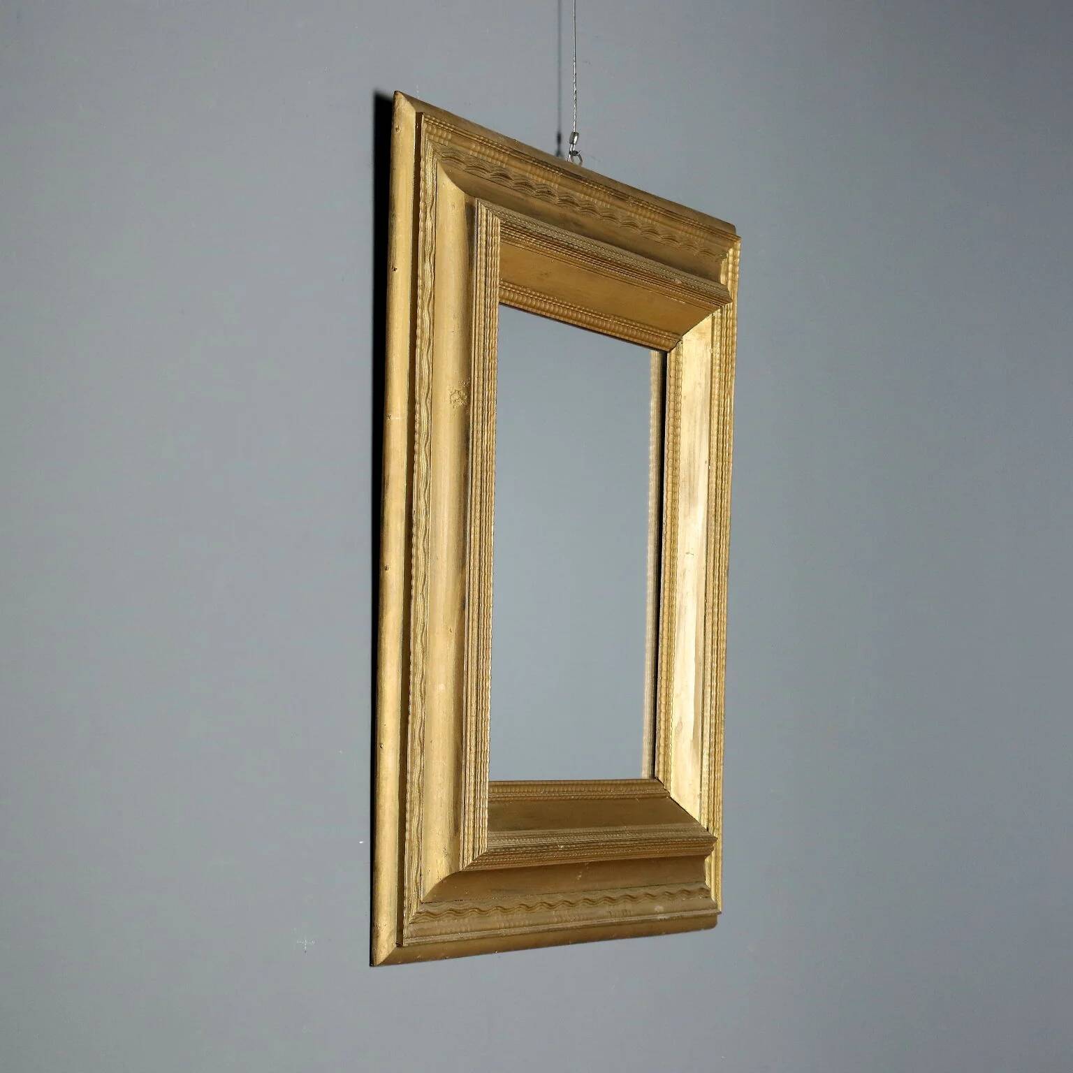 Antique gilded wooden mirror with guilloché frame, Italy, 19th century.