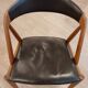 Set of 6 vintage Kai Kristiansen chairs in solid teak and black faux leather.