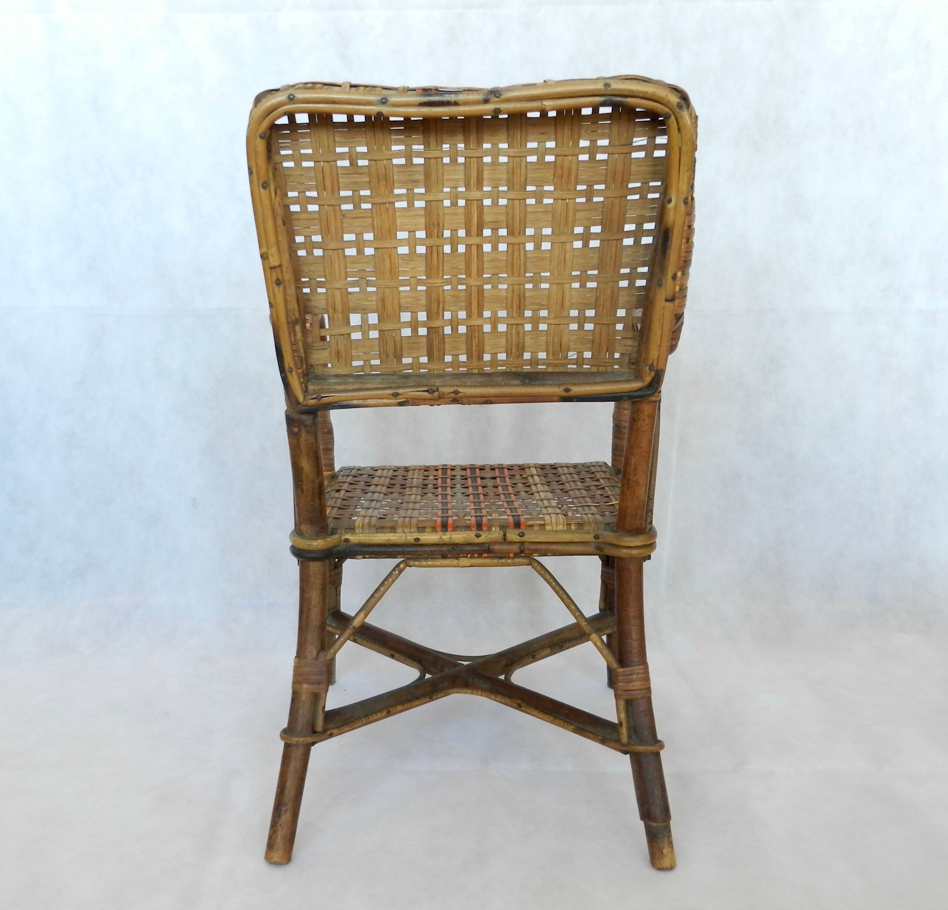 Small child vintage armchair in rattan
