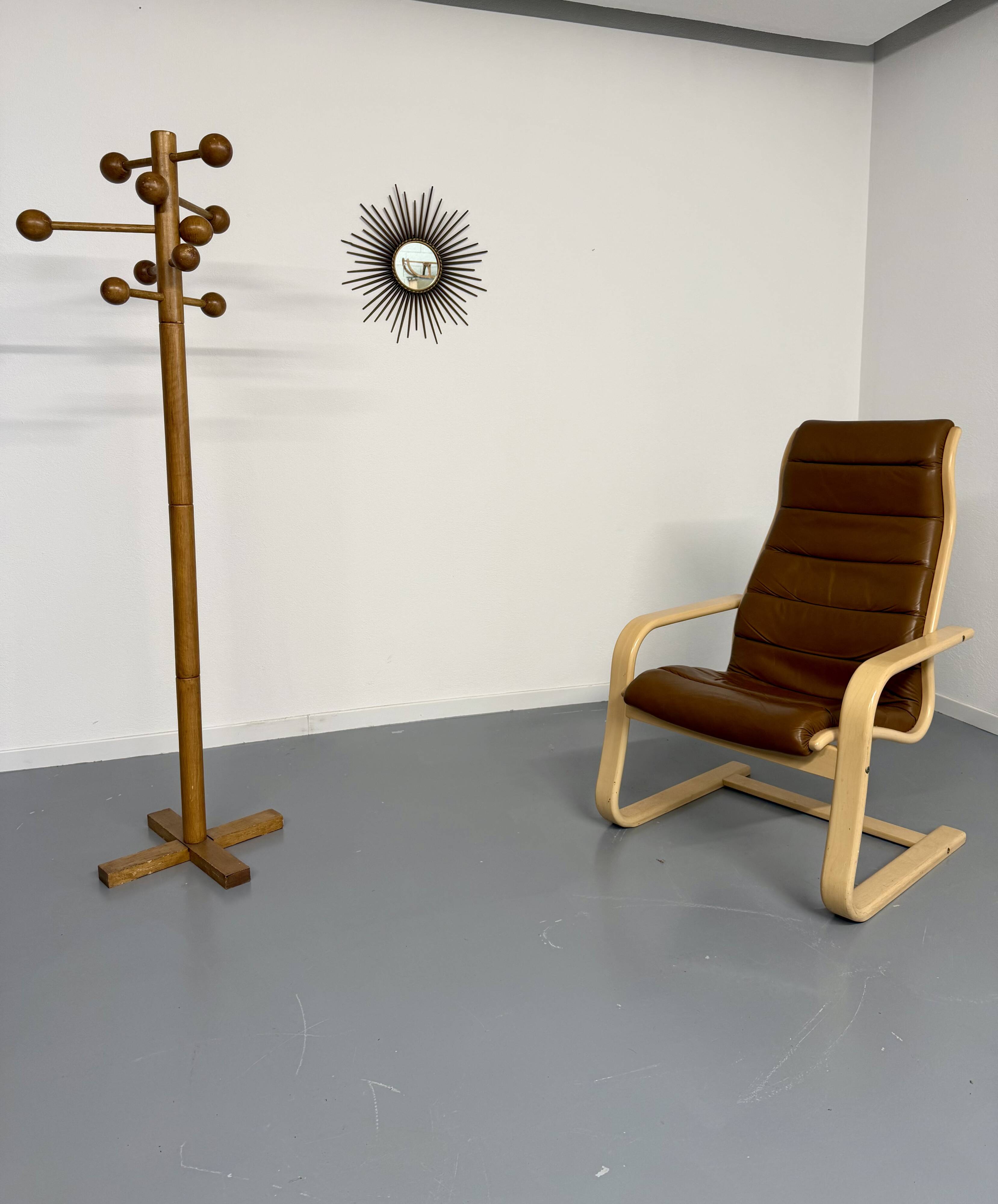 Vintage wooden coat stand with modernist design from the 1970s.