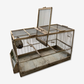 Old double bird cage made of wood and zinc