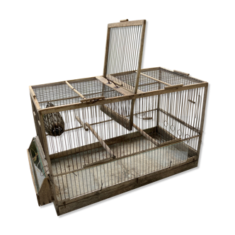 Old double bird cage made of wood and zinc