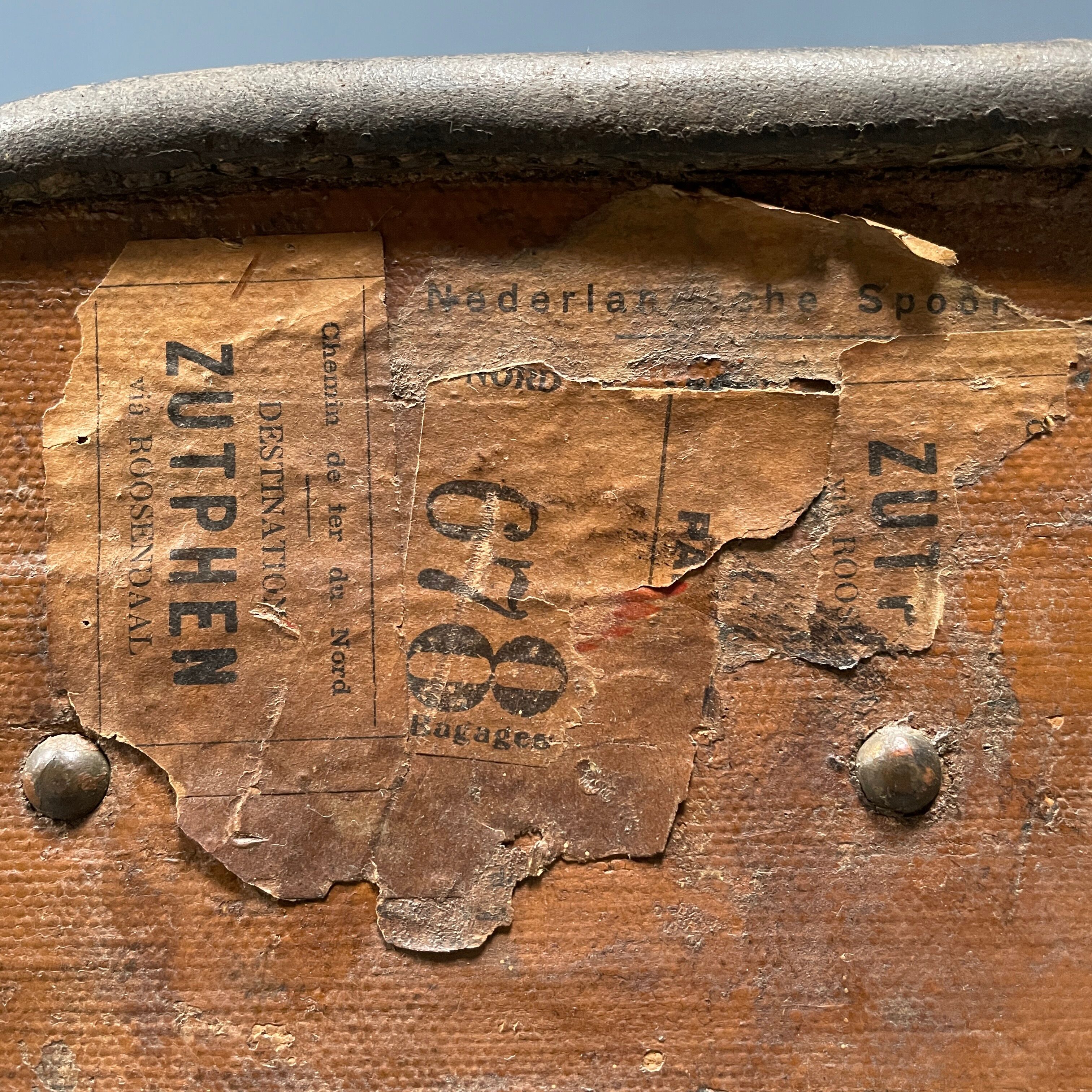 Antique brown travel case with wooden slides from the early 1900s