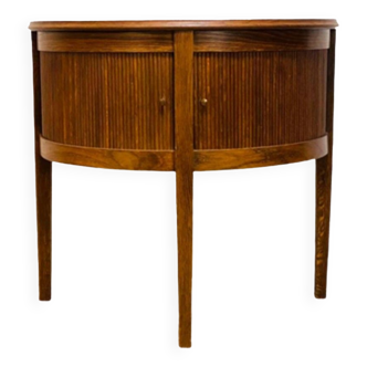 Old mahogany half-moon table with side shutters.