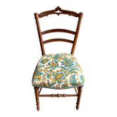 Chaise en bois ciselé et coton imprimé