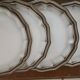 Service of 12 flat plates Salins France, taupe rim.