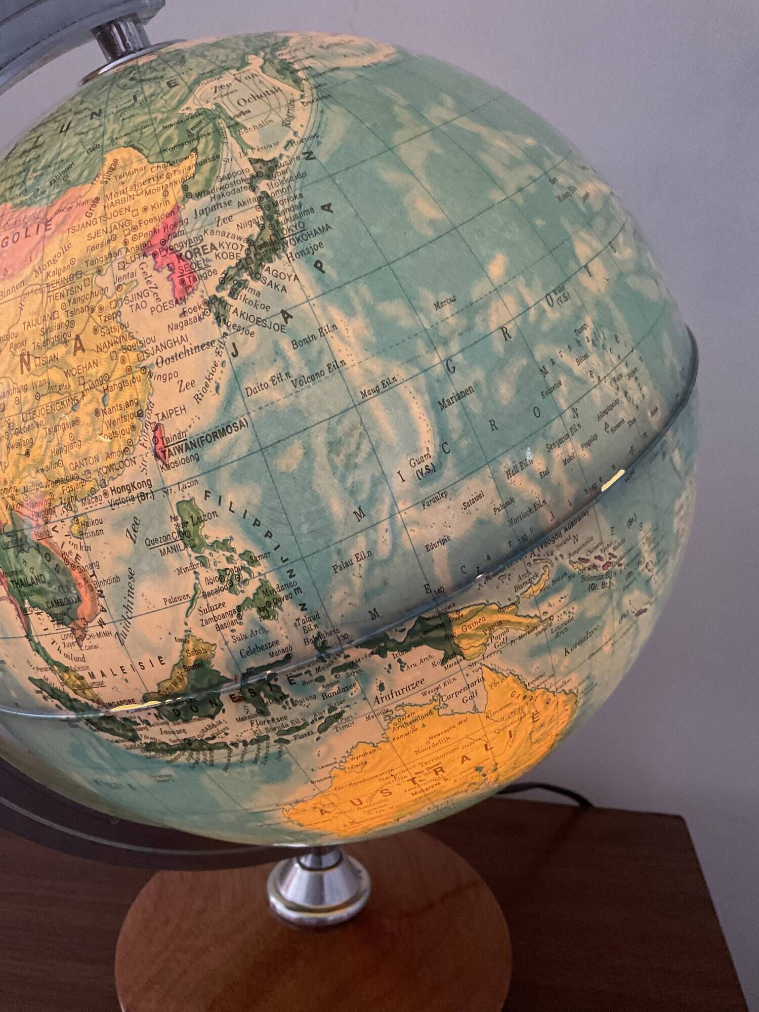 Bright vintage world map with wooden foot