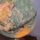 Bright vintage world map with wooden foot