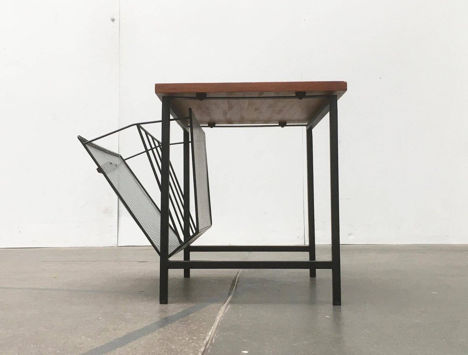 Mid-century teak side table with magazine rack.